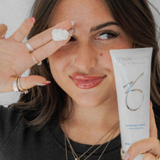 Woman posing with ZO skin products